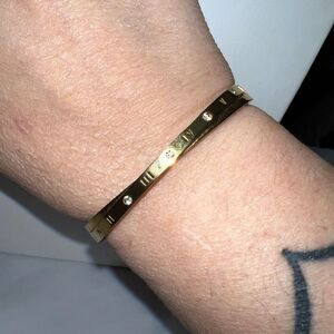 Gold Tone Roman Numerals and Crystal Bypass Bangle Bracelet